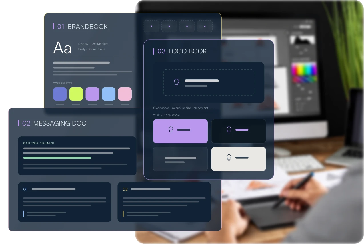 Brand system hero — brand book, messaging doc and logo book over a designer at work